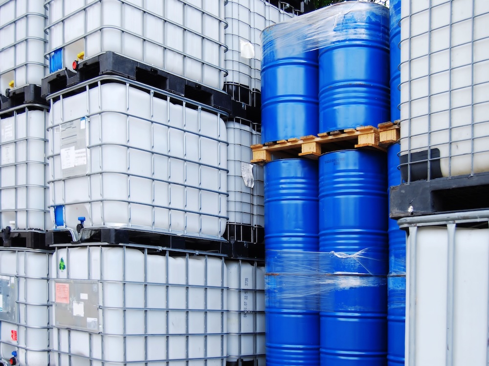 Stacked IBC totes and drums of bioaugmentation product